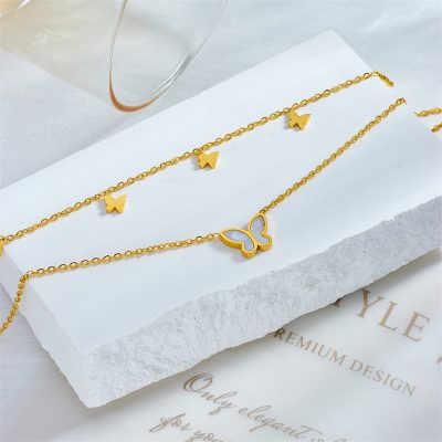 Beautiful gold butterfly necklace and bracelet set with delicate chain links, perfect for women seeking stylish accessories. High-quality jewelry from Monalisa Store.