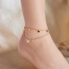 Elegant gold anklet featuring butterfly charms, perfect for enhancing your style and adding charm to your look. Ideal for women seeking stylish jewelry accessories.