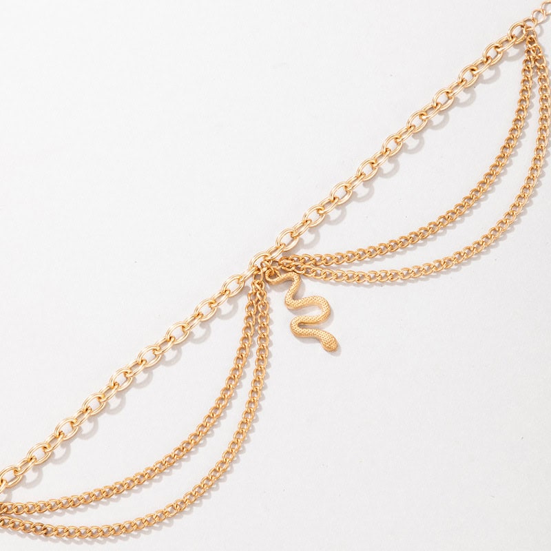 Elegant gold layered chain necklace with snake pendant, perfect for fashionable accessories and jewelry gifts.
