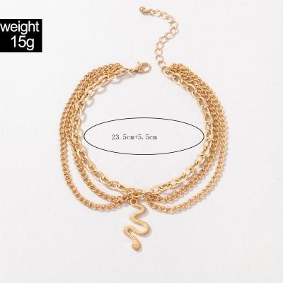 Gold snake pendant necklace with multiple chains, 23.5 cm + 5.5 cm adjustable extension, lightweight 15g, stylish accessory for women. Perfect for trendy outfits and jewelry collection.