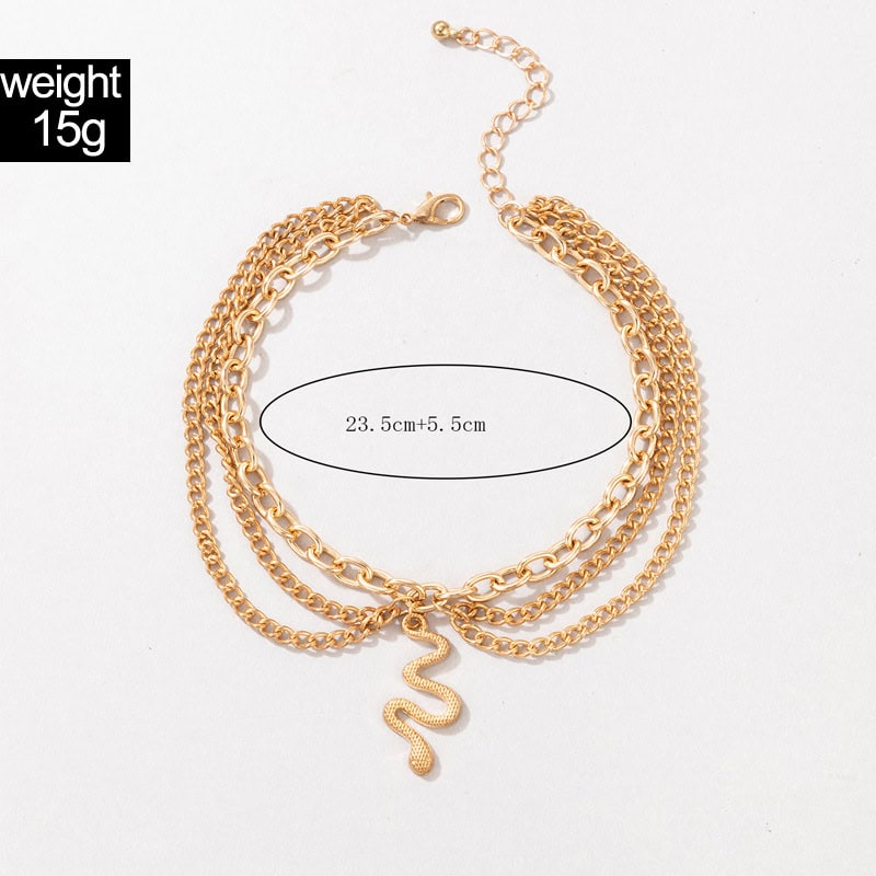 Gold snake pendant necklace with multiple chains, 23.5 cm + 5.5 cm adjustable extension, lightweight 15g, stylish accessory for women. Perfect for trendy outfits and jewelry collection.
