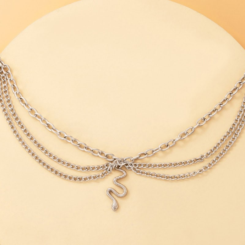 Stunning layered silver snake pendant necklace featuring multiple chains, perfect for jewelry lovers. Shop high-quality, fashionable jewelry at Monalisa Store for a sophisticated look.