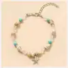 Elegant beach shell jewelry with starfish pendant, turquoise beads, and clear crystals, perfect for summer or vacation accessories, available at Monalisa Store for stylish beachwear.