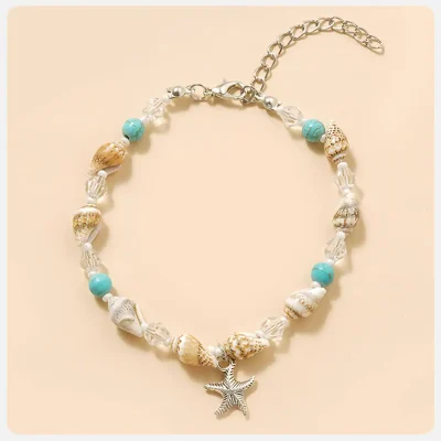 Elegant beach shell jewelry with starfish pendant, turquoise beads, and clear crystals, perfect for summer or vacation accessories, available at Monalisa Store for stylish beachwear.