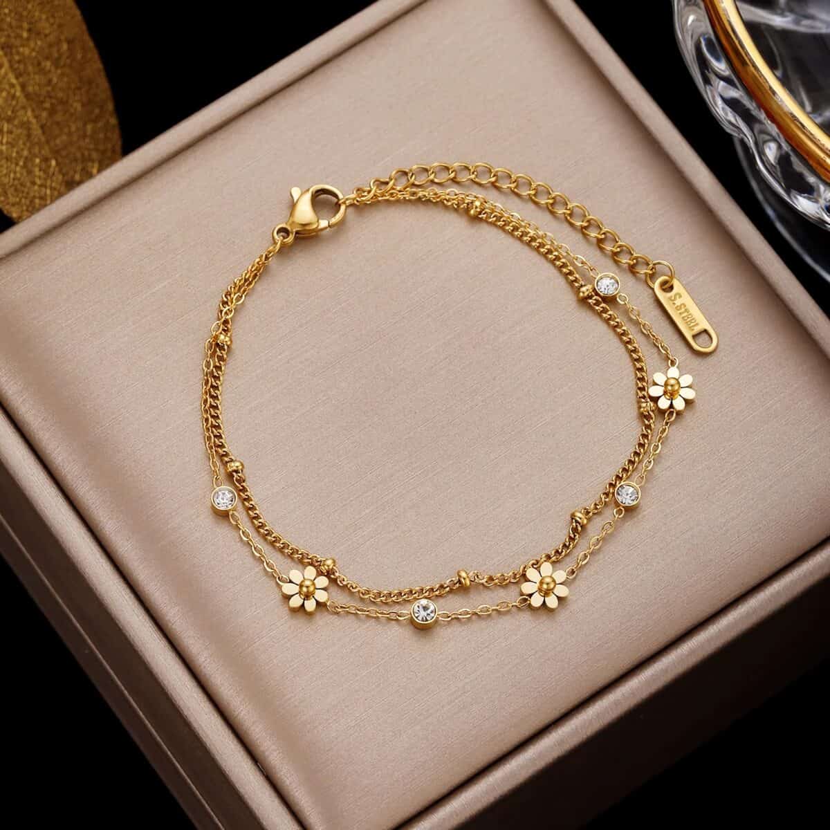Delicate gold bracelet featuring floral design and sparkling crystals, perfect for stylish accessories. Shop high-quality jewelry at Monalisa Store for elegant fashion and gift options.