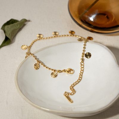 Elegant gold charm bracelet with floral design charms, perfect for women's accessories, available at Monalisa Store for stylish and trendy jewelry options.