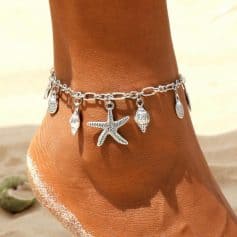 Delicate silver beach-themed anklet with starfish, shell, and ocean charm, perfect for summer or beachwear. Made of high-quality sterling silver, lightweight, and comfortable for everyday or vacation accessories.