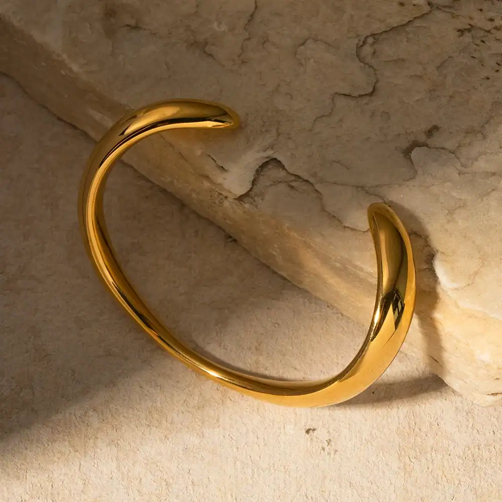 Stylish gold cuff bracelet from Monalisa Store, featuring a sleek, modern design with high-quality craftsmanship, ideal for enhancing any fashion-forward look.