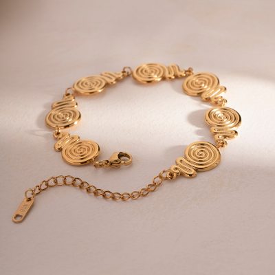 Luxury gold bracelet with spiral design, perfect for stylish accessories and jewelry lovers. Crafted with high-quality materials, ideal for enhancing your fashion statement.