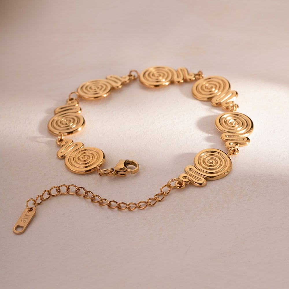 Luxury gold bracelet with spiral design, perfect for stylish accessories and jewelry lovers. Crafted with high-quality materials, ideal for enhancing your fashion statement.