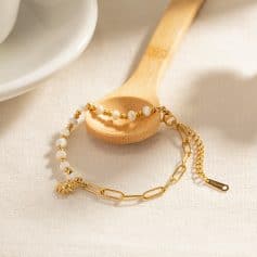 Delicate jewelry featuring white pearls and gold accents, perfect for enhancing your fashion statement.