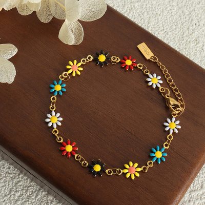 Vibrant daisy flower bracelet with multicolor petals, gold chain, and secure clasp, perfect for stylish accessories and jewelry lovers from Monalisa Medical's online jewelry collection.