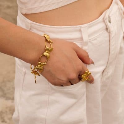Gold butterfly bracelet and ring crafted with intricate detail, perfect for enhancing your accessory collection and expressing your style.