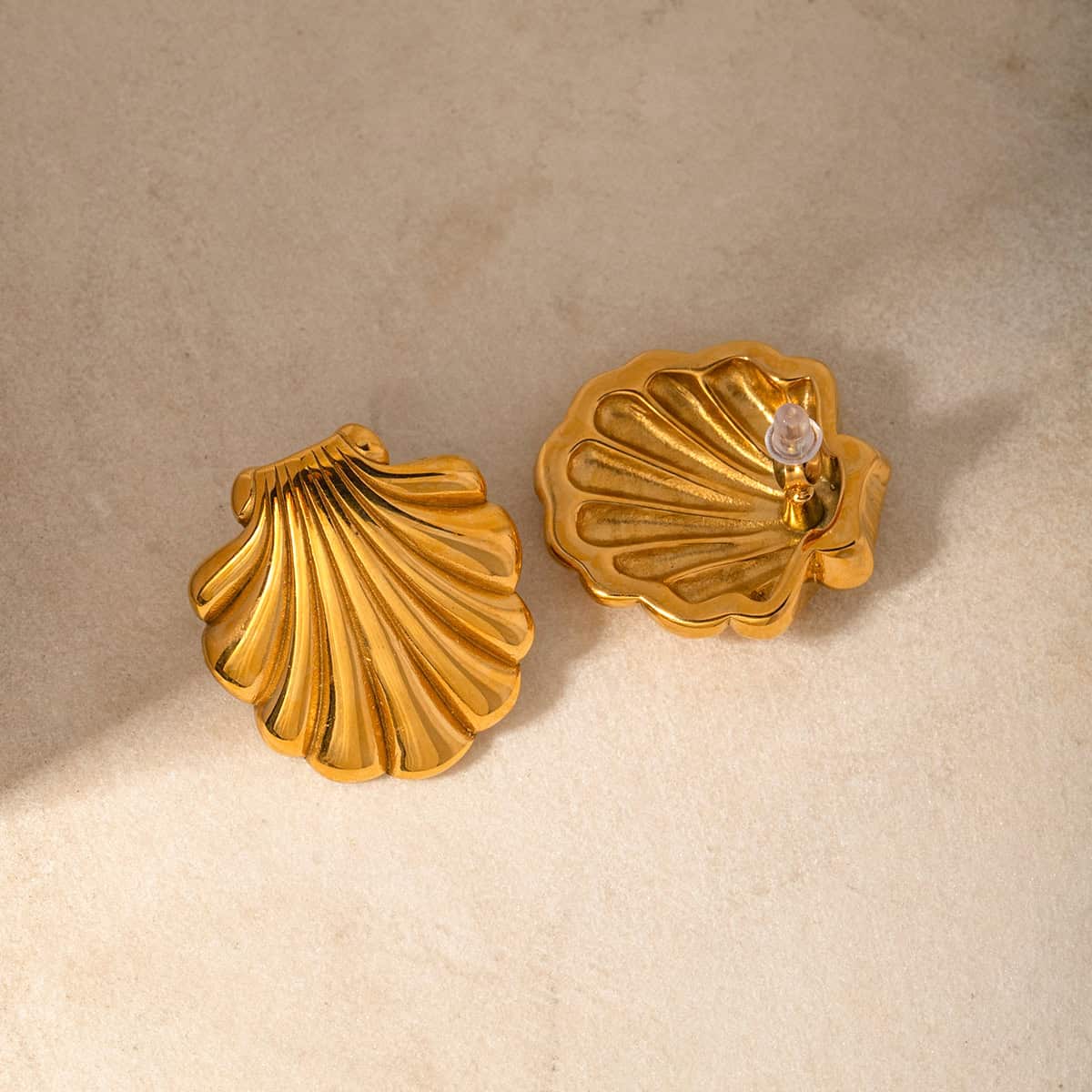 Elevate your style with luxurious gold shell earrings, ideal for jewelry lovers seeking unique, high-quality accessories. Perfect for gifting or personal collection.