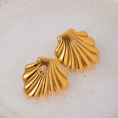 Luxurious gold shell earrings with intricate design, ideal for fashion-forward individuals seeking unique jewelry pieces.