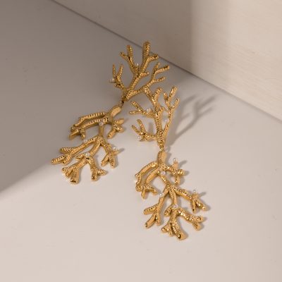 Stylish gold coral-inspired earrings with pearls, perfect for elegant occasions and stylish jewelry collections.