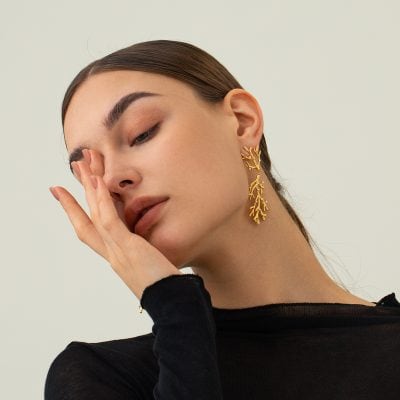 Beautiful gold coral-inspired earrings showcased at Monalisa Store, perfect for stylish jewelry lovers seeking unique and trendy accessories.