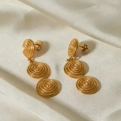 Gold spiral dangling earrings, stylish jewelry for women, perfect for parties and special occasions, made with high-quality gold-plated material, versatile accessory for fashion-forward looks.