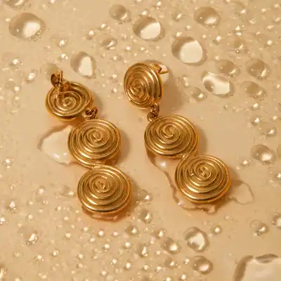Luxurious gold earrings with intricate spiral design, ideal for enhancing any outfit. Shop now at Monalisa Store for stylish and high-quality jewelry.