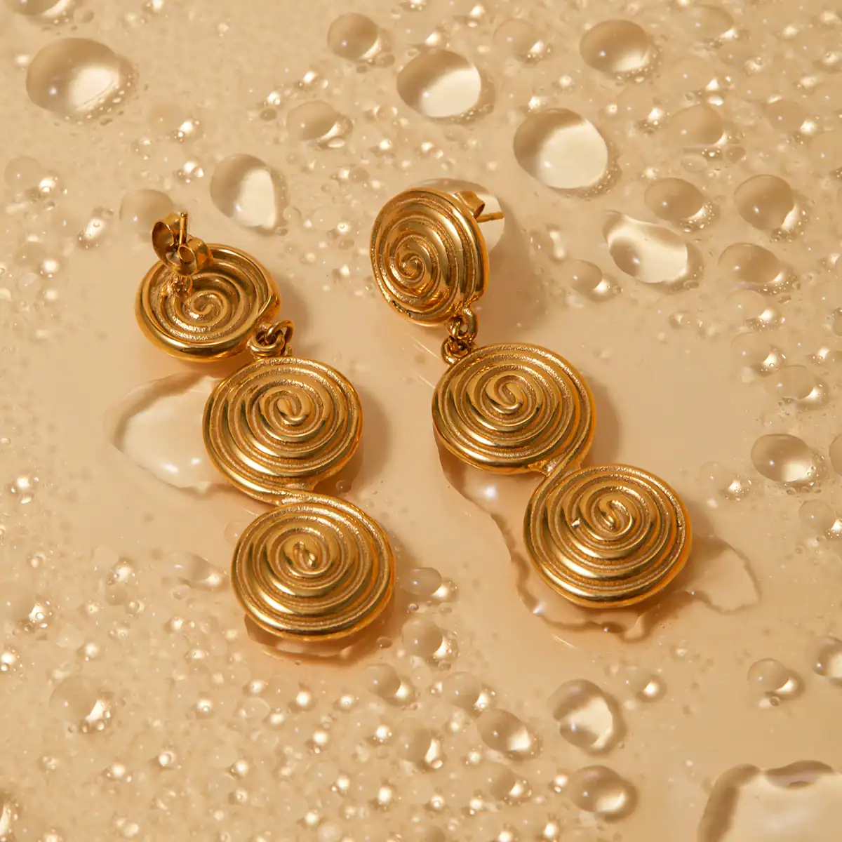 Luxurious gold earrings with intricate spiral design, ideal for enhancing any outfit. Shop now at Monalisa Store for stylish and high-quality jewelry.