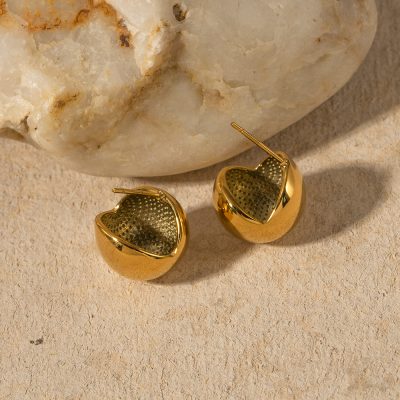 Gold heart-shaped earrings with intricate inner details perfect for stylish accessories.