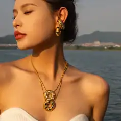 Gold jewelry set with intricate necklace and earrings, perfect for women seeking luxurious and stylish accessories from Monalisa Store. Elevate your fashion game today!.