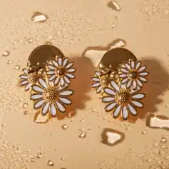 Elegant daisy flower earrings with gold and white enamel design, perfect for stylish accessories. High-quality jewelry ideal for fashion-conscious individuals.