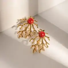 Bright gold coral-shaped earrings featuring striking red beads, perfect for stylish accessorizing and adding a touch of elegance to your outfit.