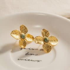 Stunning gold flower earrings featuring intricate petal design and green gemstone centers, perfect for stylish accessories and jewelry lovers. Shop at Monalisa Store for high-quality fashion jewelry.