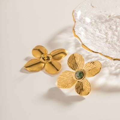 Beautiful gold flower-shaped earrings featuring a polished and textured design, perfect for enhancing your style. Crafted with high-quality materials, these trendy accessories are ideal for any fashion-forward woman.