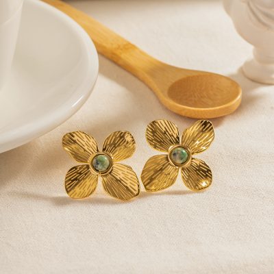 Stylish gold flower earrings featuring textured petals and a central pearl, perfect for enhancing any jewelry collection, available at Monalisa Store.