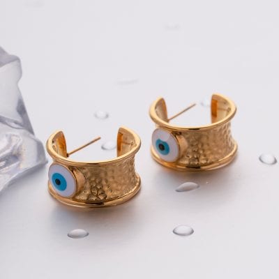 Elegant gold earrings with blue evil eye bead design for protection and style.