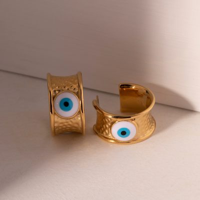 Beautiful gold-tone evil eye rings with enamel eye design, perfect for protection and fashion statement. Unique jewelry for stylish accessories and spiritual symbolism.