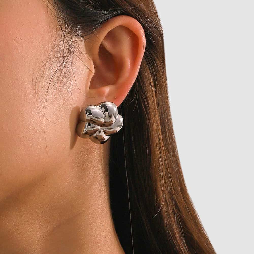 Stylish silver floral earrings, perfect for women seeking unique jewelry pieces. Shop premium earrings online at Monalisa Medical for fashionable accessories.