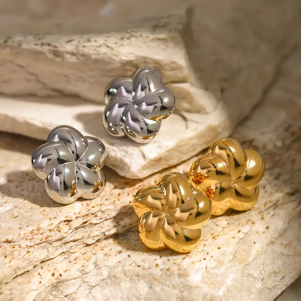 Elegant gold and silver metallic designer rings for women, perfect for jewelry collections and statement accessories.