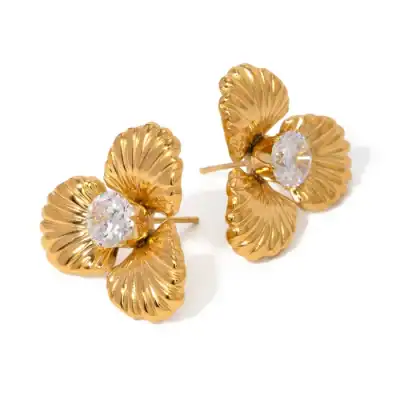 Luxurious gold flower earrings featuring intricate petal design and sparkling crystal center for sophisticated style and jewelry elegance. Perfect for special occasions or everyday chic.