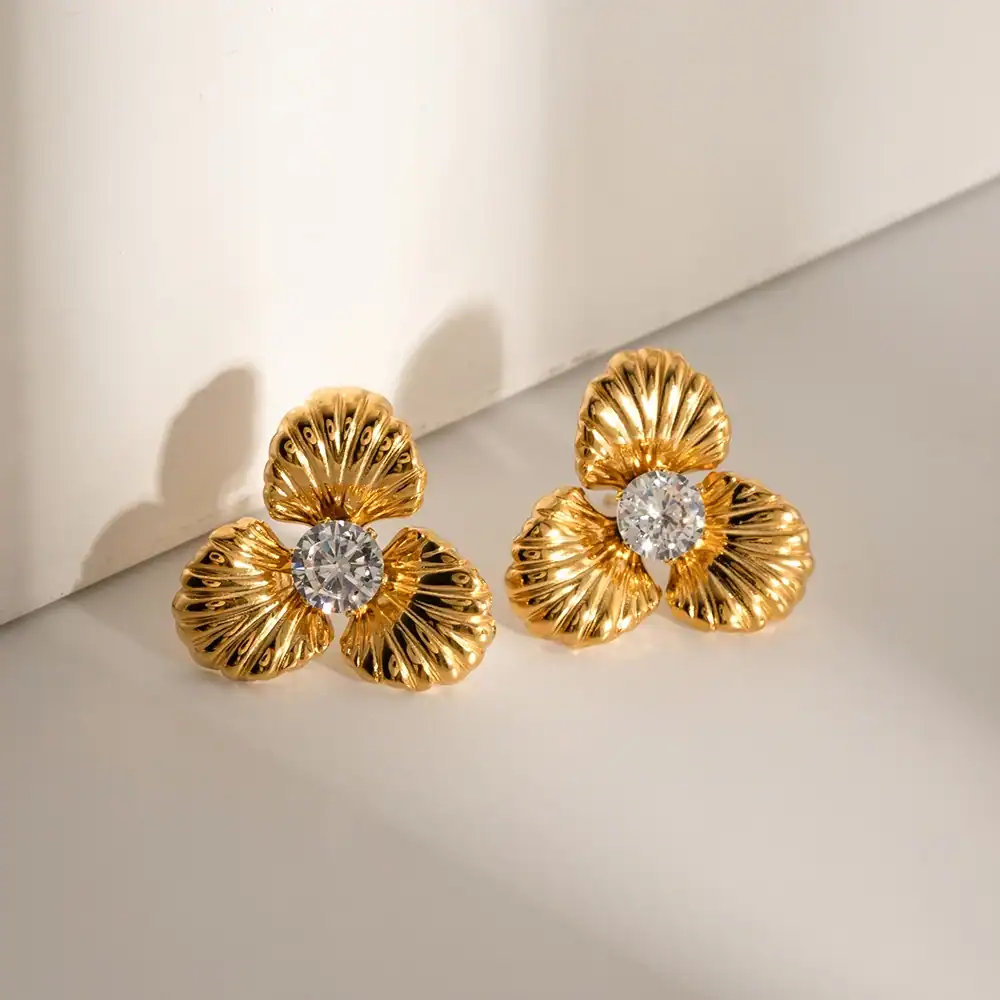 Luxury gold flower earrings featuring sparkling diamonds, perfect for fashion-forward accessories and jewelry lovers. Elevated style and unique design for many occasions, available at Monalisa Store.