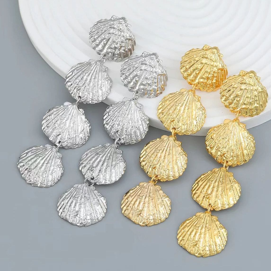 Elegant silver and gold shell earrings for women, perfect for stylish accessories and jewelry lovers. High-quality, trendy design ideal for casual or special occasions.