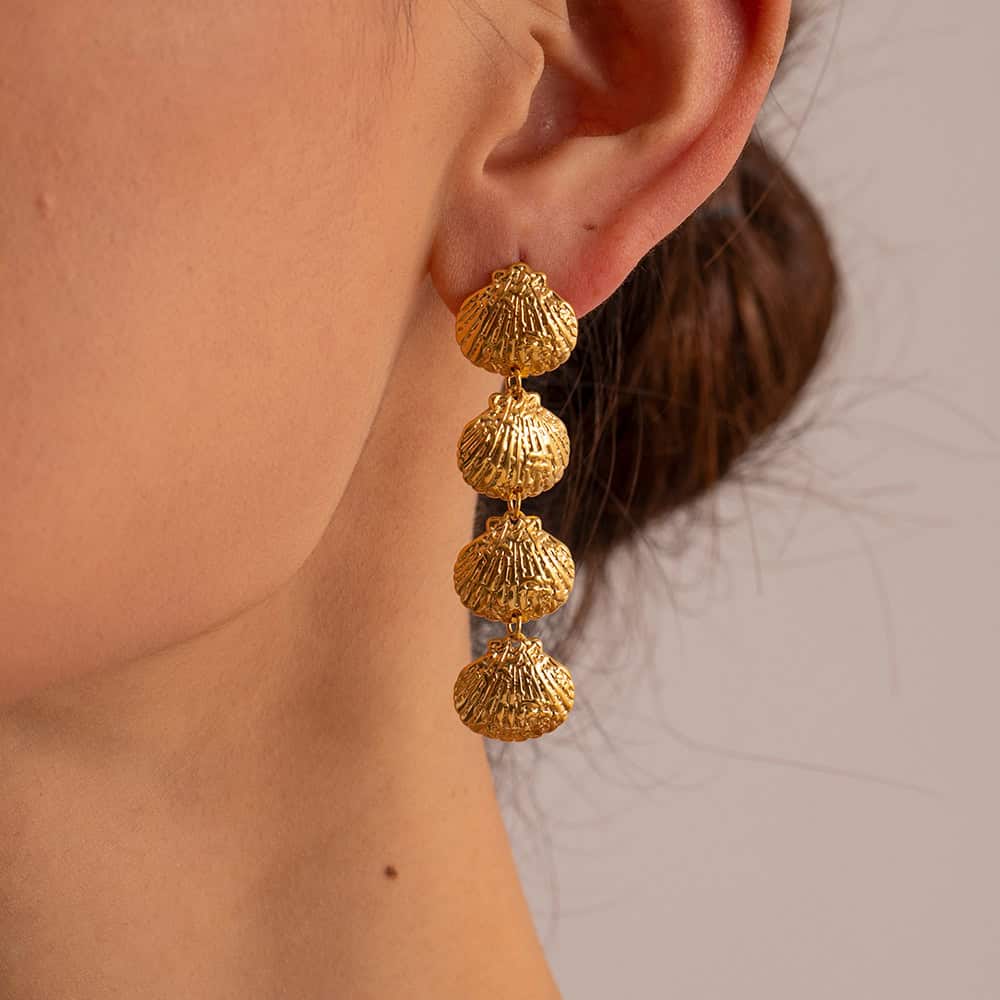 Elegant gold shell earrings featuring multiple layered shells, perfect for beach-inspired or sophisticated summer jewelry styles.