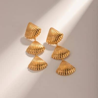 Beautiful gold shell-shaped statement earrings perfect for stylish jewelry collections at Monalisa Medical. Crafted with high-quality materials for a chic, modern look.