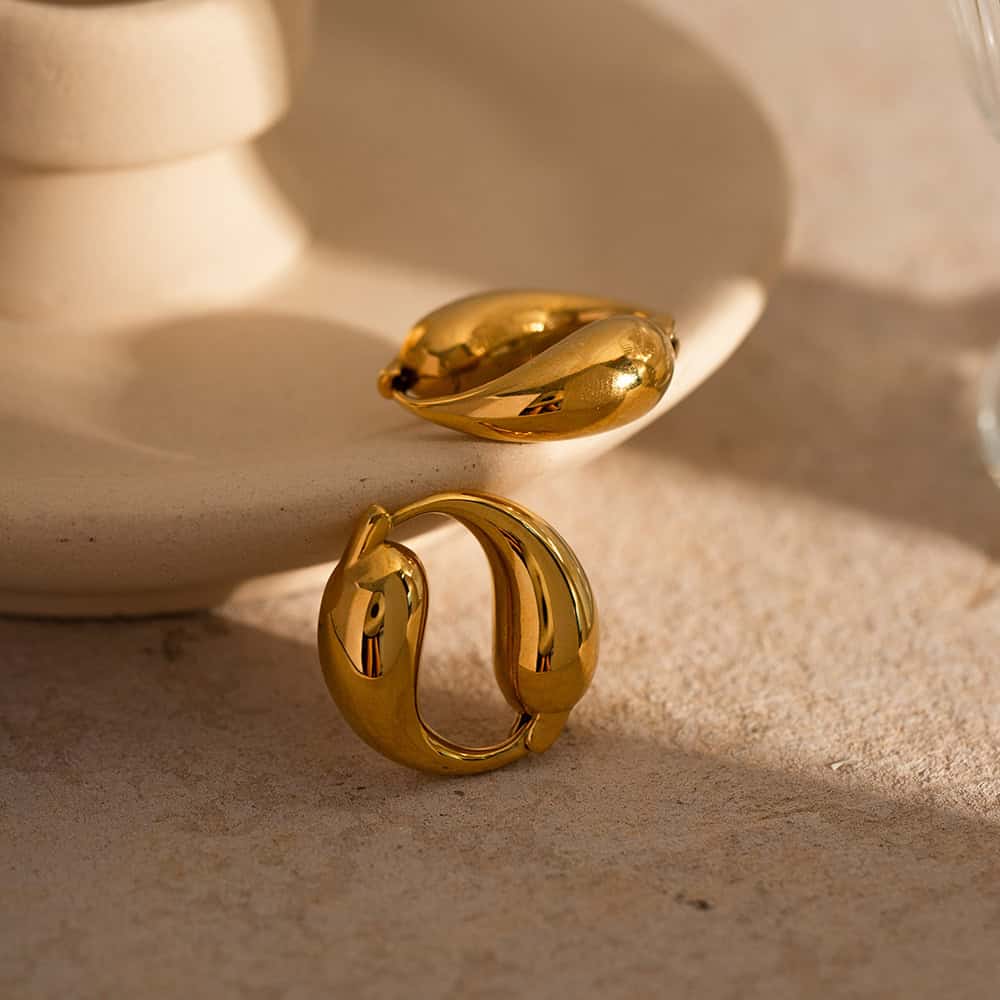 Luxurious gold earrings and rings, perfect for stylish women and special occasions. High-quality, trendy jewelry available at Monalisa Store for all your fashion needs.