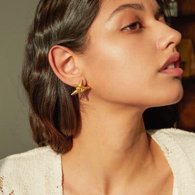 Gold star-shaped earring designed for women, perfect for enhancing your style. Shop now at Monalisa Store for exquisite jewelry and accessories.