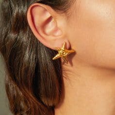 Elegant gold starfish earrings for women, perfect for nautical-themed jewelry and ocean-inspired accessories. High-quality, stylish, and ideal for casual or formal occasions.