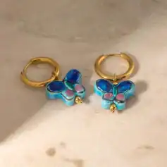Vibrant butterfly enamel earrings with gold hoop accents, perfect for elegant accessories and stylish jewelry collections.