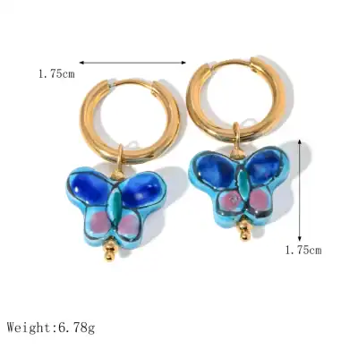 Vibrant butterfly hoop earrings featuring enamel flowers, gold plating, perfect for fashion-forward and jewelry lovers.
