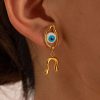 Evil eye jewelry with gold accents, featuring eye-shaped design and a dangling horseshoe charm, perfect for protection and style. Unique fashion accessory for trendy looks.