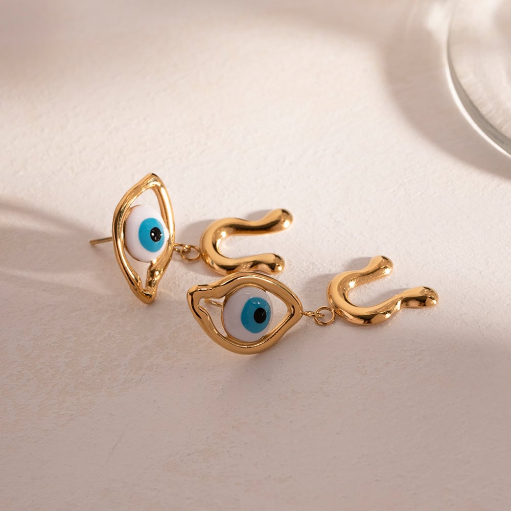 Stylish gold evil eye earrings with eye-shaped charms and dangling eye design, perfect for protection and trendy accessories.