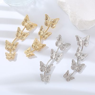 Stunning gold and silver butterfly-shaped earrings, perfect for a stylish, eye-catching accessory at Monalisa Medical Store.