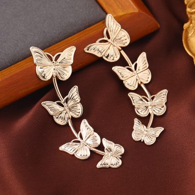 Silver butterfly earrings for women, stylish and trendy jewelry accessory, perfect for special occasions or everyday wear.