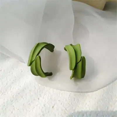 Stylish green statement earrings for women and girls, perfect accessory for casual and formal occasions.